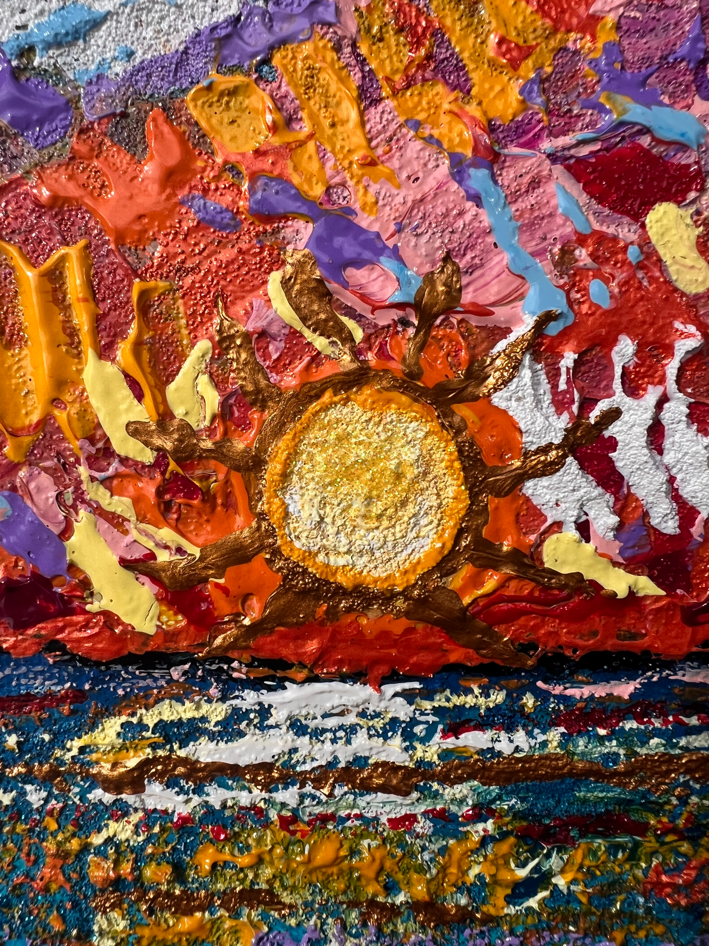 Crimson sunset over rippling blue